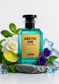 A bottle of Shamm Arctic Ice Extrait de Parfum centered on a gray stone slab, surrounded by mint leaves, a white rose, purple flowers, a lime half, and clear ice cubes against a clean white background.